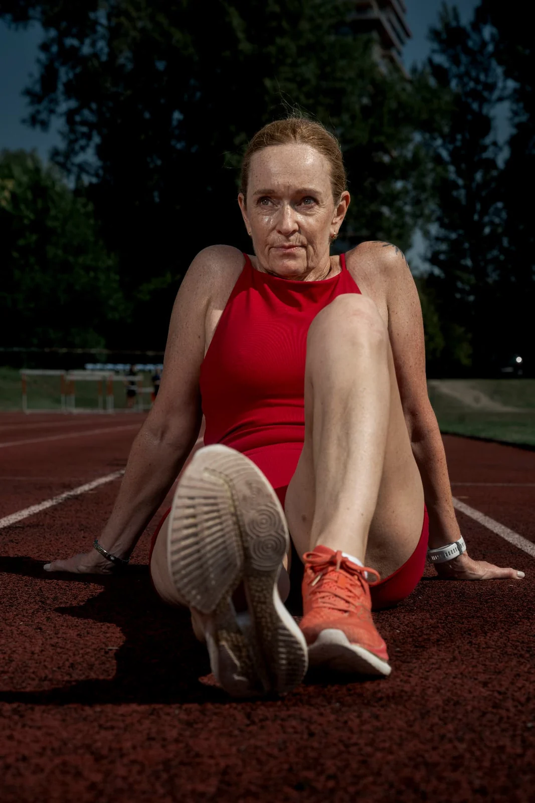Birgit Pfeifer sitting on the track between two running sessions