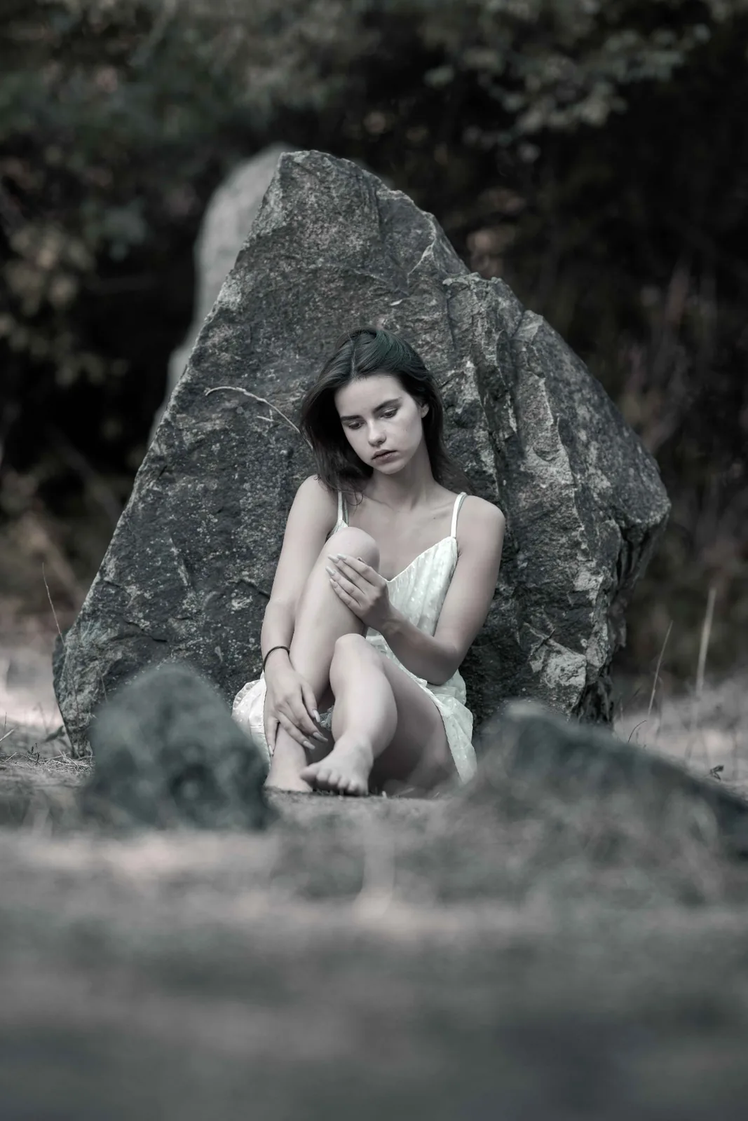 Editorial portrait of Tiana between stone, light and shadow on the Donauinsel in Vienna
