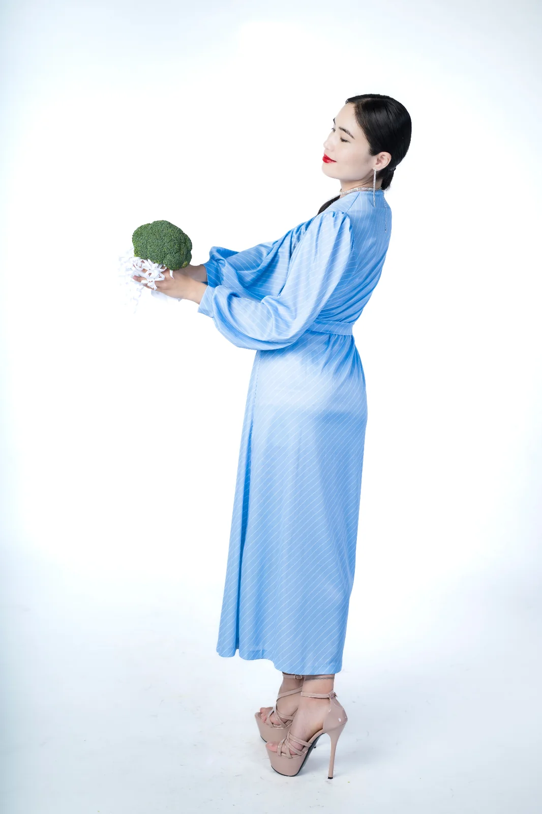 Editorial fashion portrait in blue couture exploring expression, movement and modern fine art photography.