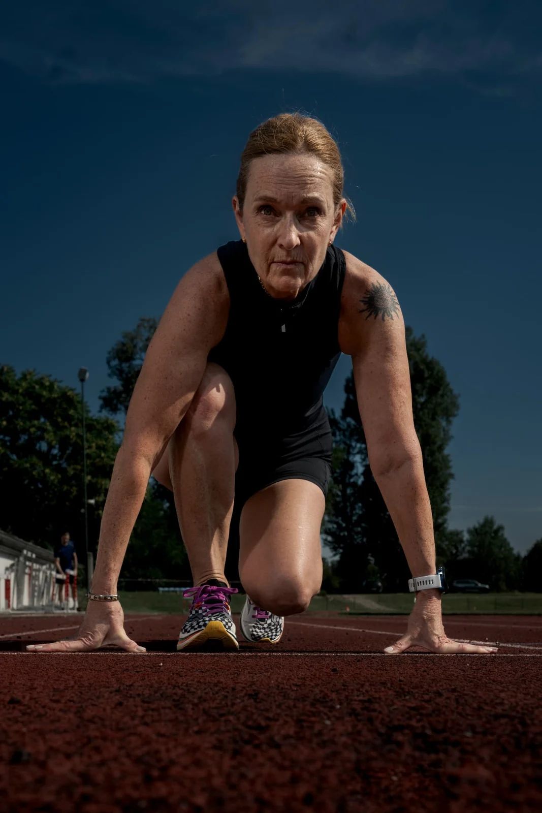 Birgit Pfeifer concentrated in starting position on the track