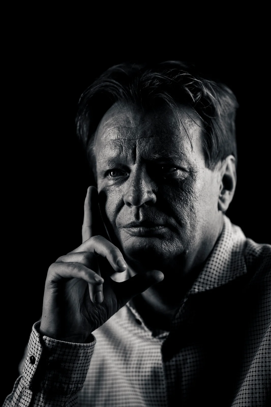 Black and white executive portrait — contemplative leadership presence, editorial photography Vienna