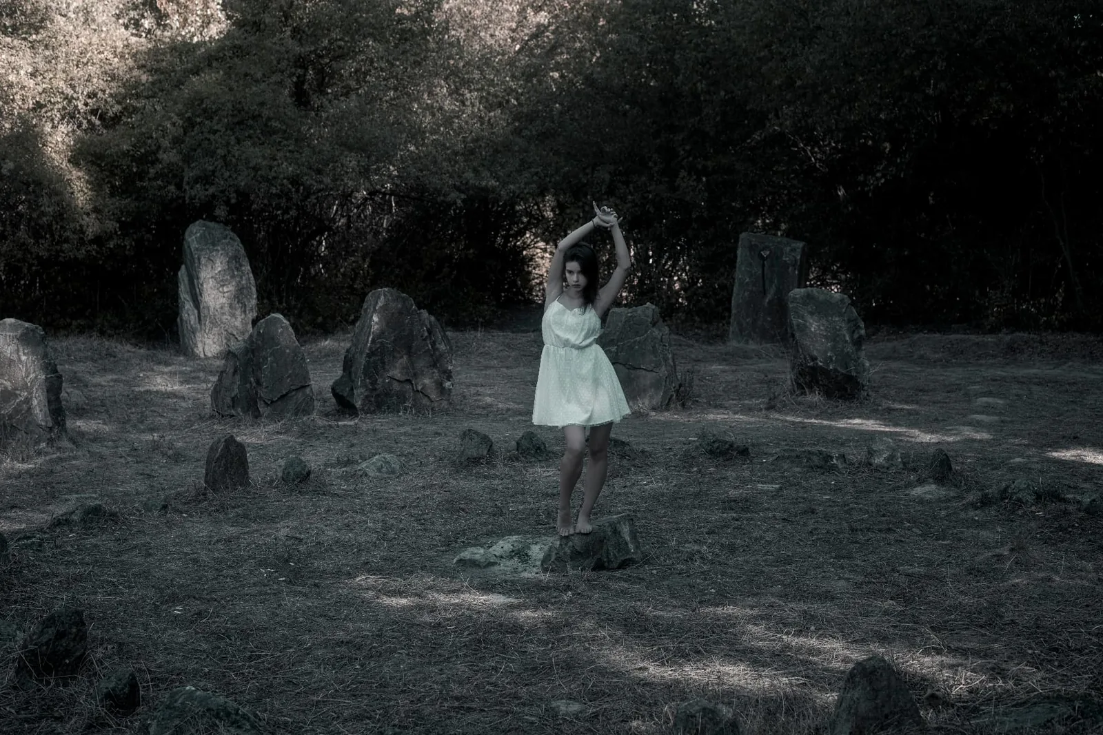 The Stone Circle on the Donauinsel Tiana in a light dress among the stones of the stone circle on the Donauinsel in Vienna