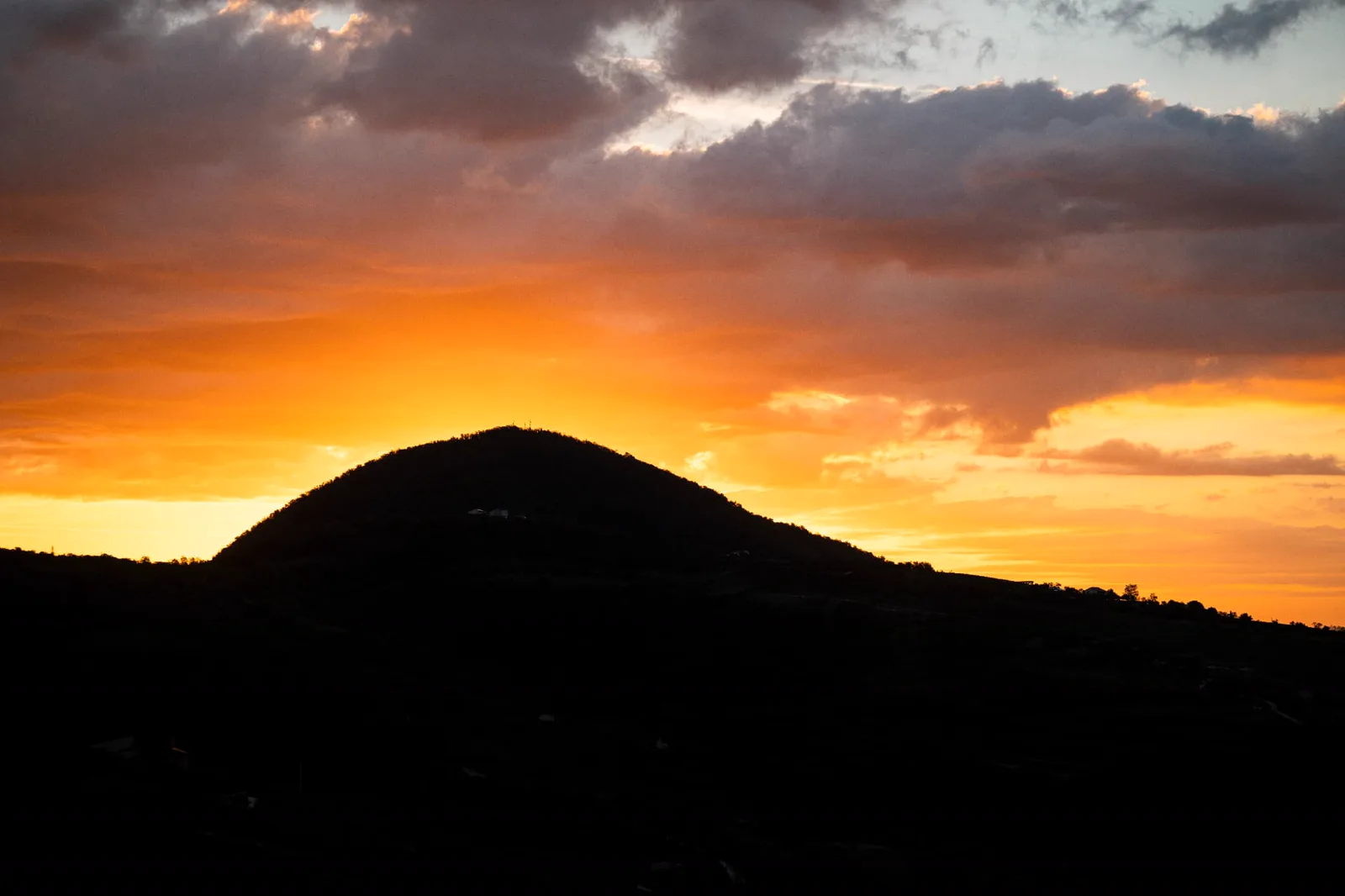 Cone-shaped volcanic hill in the Colli Euganei at sunset