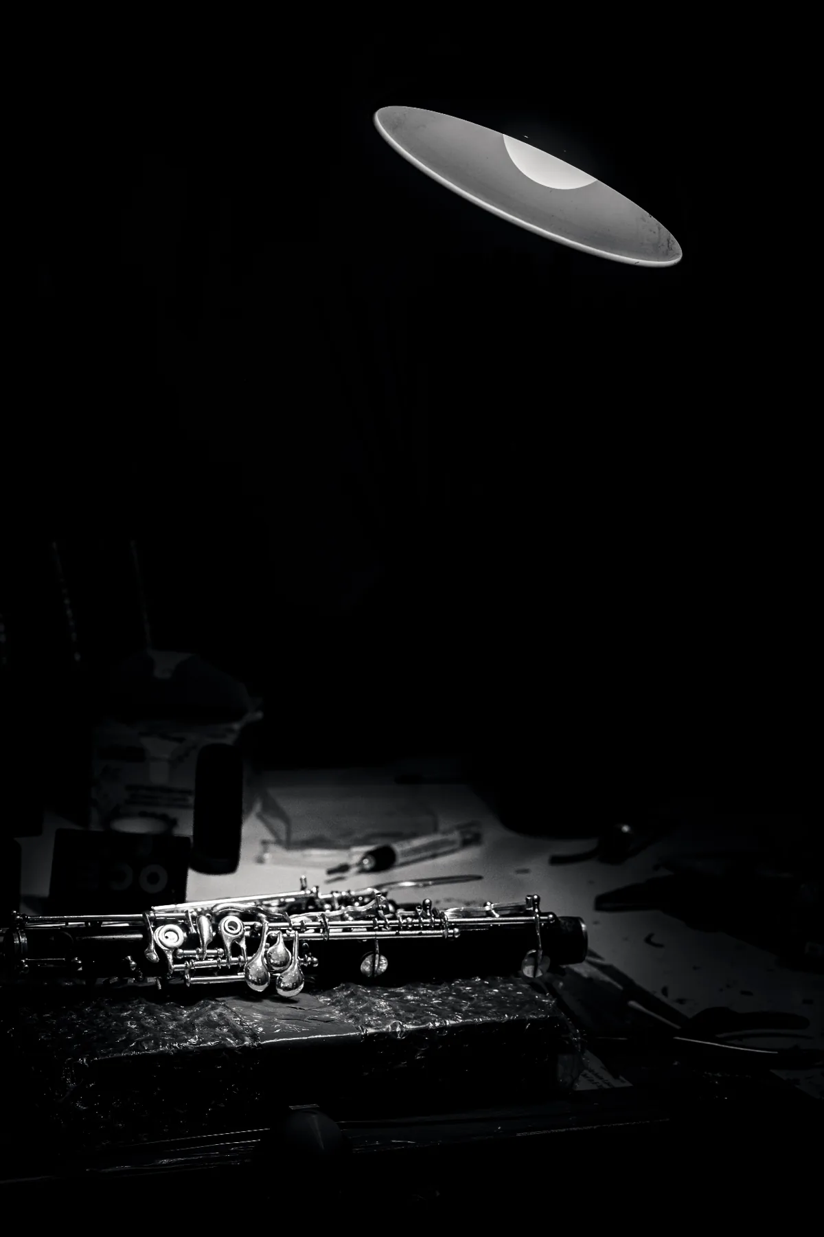 Behind the First Note A handcrafted clarinet illuminated on a workbench inside the workshop of Viennese master woodwind instrument maker Florian Köck.