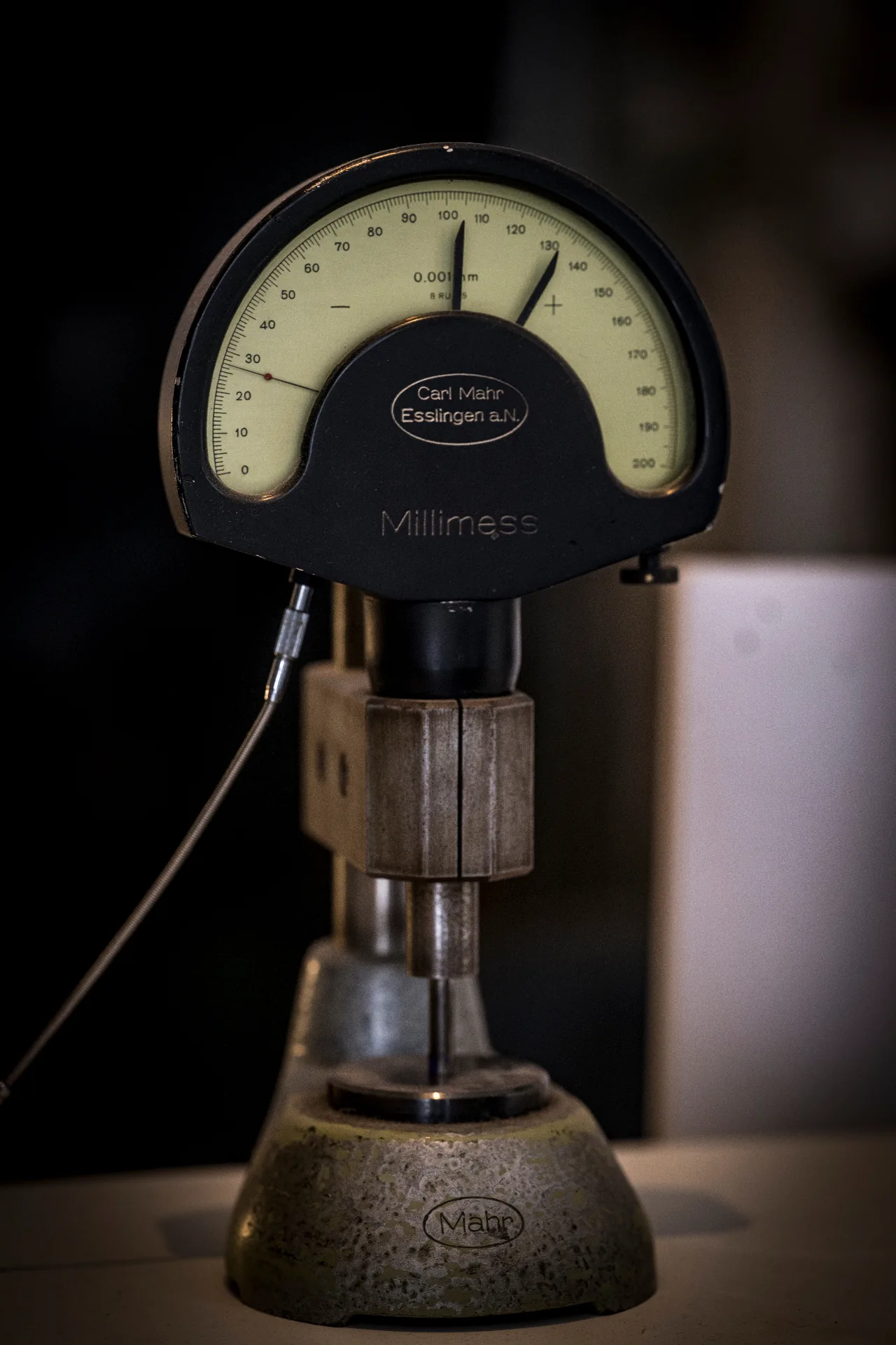 Vintage Mahr Millimess precision dial gauge measuring to 0.001 mm — a precision measuring instrument used on Florian Köck's workbench.