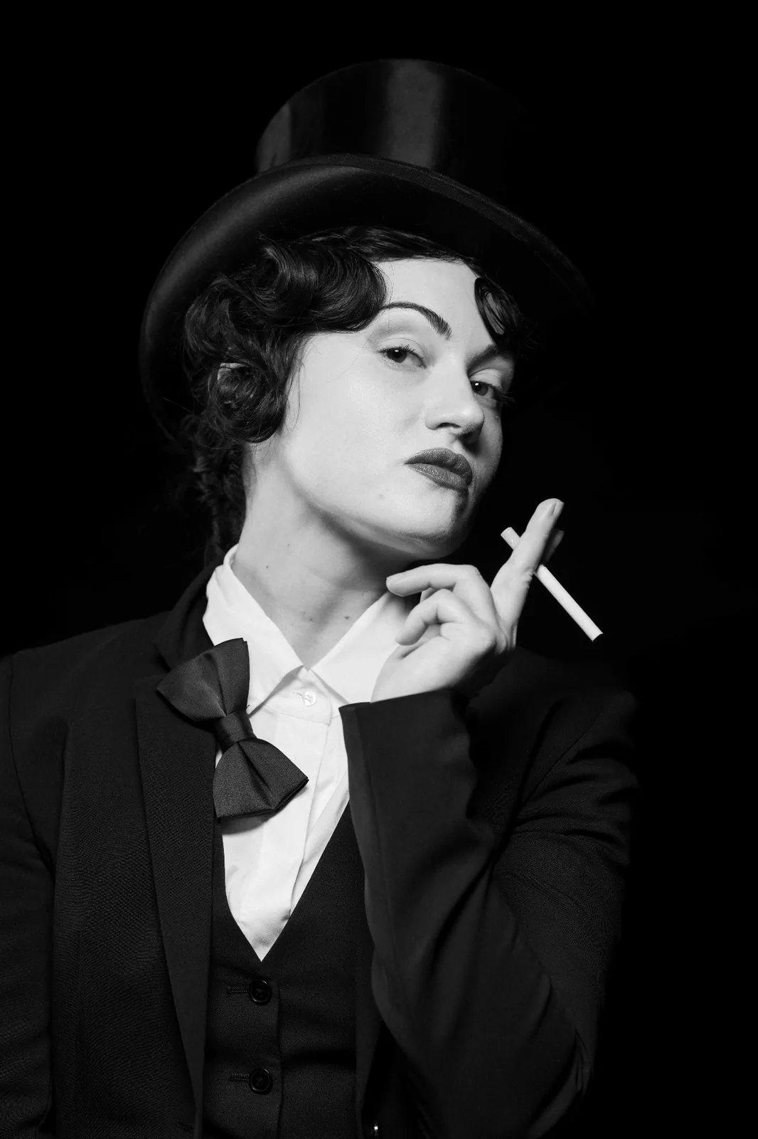 Quiet reference image — woman in top hat, tuxedo and bow tie, a subtle nod to the classical studio portraiture and the visual language of Marlene Dietrich that inspired Monochrome Presence