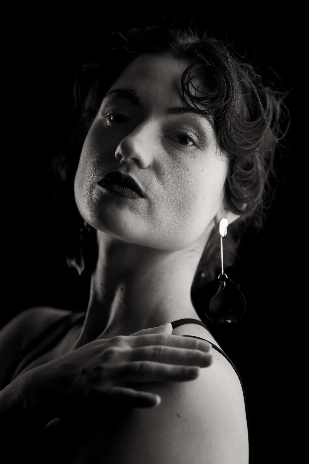 Refined black and white editorial portrait — sculpted highlights, soft skin tonality and quiet expression from the Monochrome Presence series